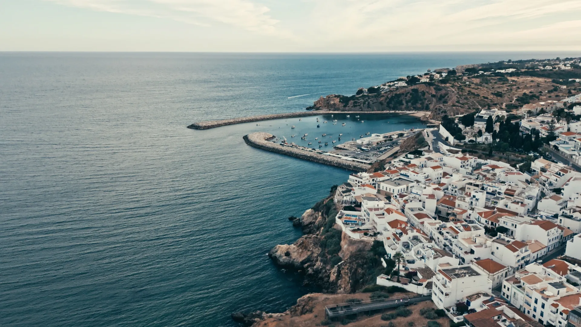 Portugal travel video thumbnail from drone perspective, showing beaches, mountains, and cityscapes