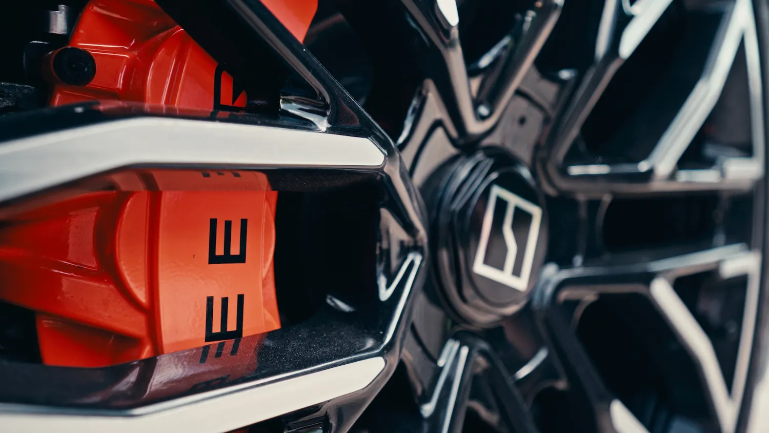 Close-up of Zeekr 001 wheel with brakes, highlighting electric car design and performance details