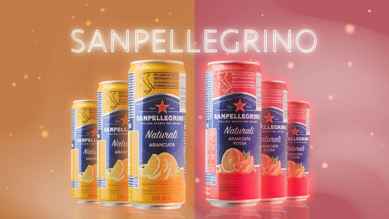 A chilled can of Sanpellegrino sparkling beverage with condensation, placed on a light background, highlighting its colorful branding.